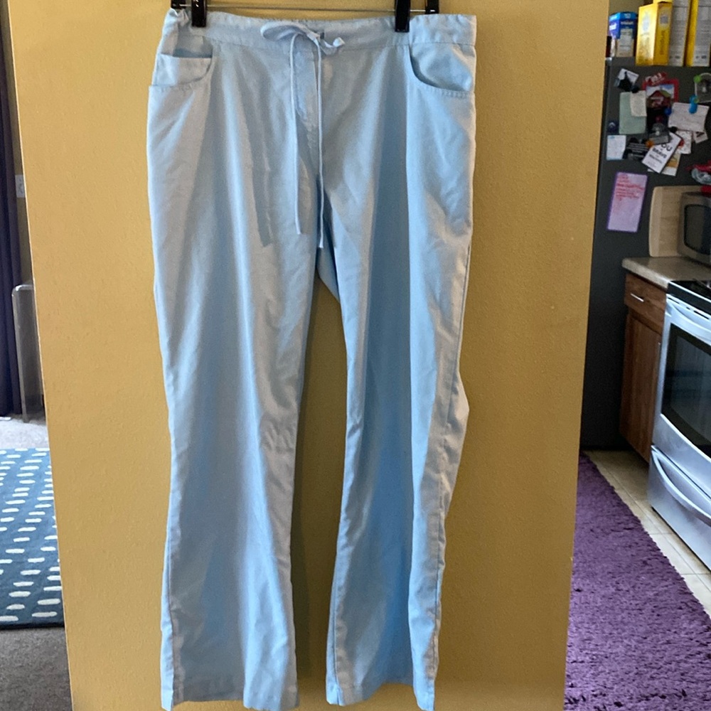 Scrub pants. Very light blue